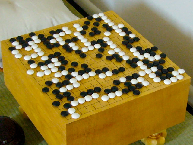 A Go board with a game of Go being played